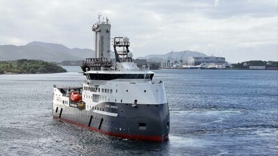 The CSOV Olympic Boreas testing the gangway system, the construction yard, Ulstein Verft, in the background.
