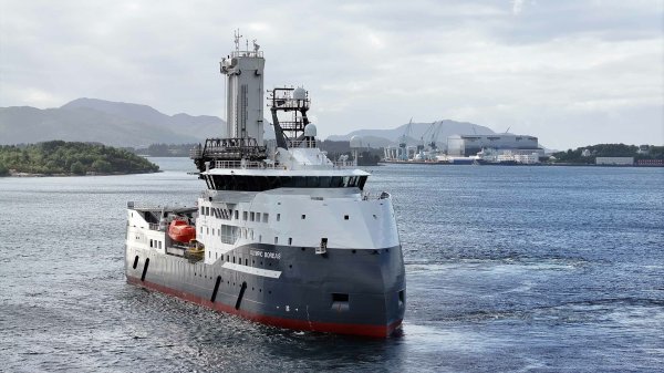 The CSOV Olympic Boreas testing the gangway system, the construction yard, Ulstein Verft, in the background.