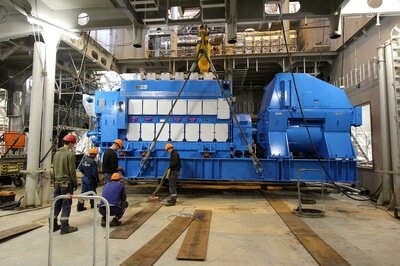 People look small next to the engine.