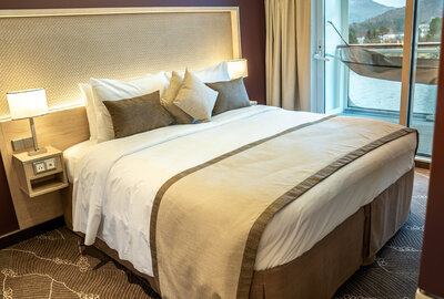 Details of one of the suites with floor-to-ceiling windows opening up to the hammock on the balcony.