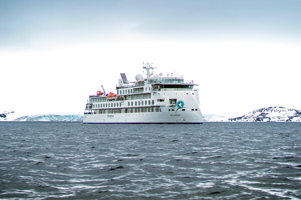 Greg Mortimer in icy waters, photo courtesy of Aurora Expeditions.