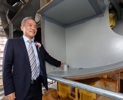 Placing a coin for good luck and fortune on the Ocean Victory.