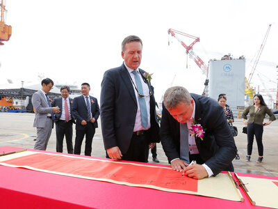 Ulstein representatives Lars Ståle Skoge and Trond Gundersby placing their signatures at the keel laying ceremony on the Ocean Victory.