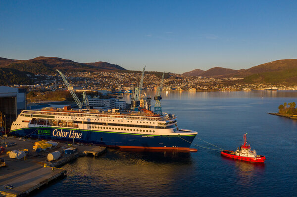 The evening sun settling over the 'Color Hybrid' during her launch from the dock hall at Ulstein Verft. (Photo: Oclin / Hallstein Mala)