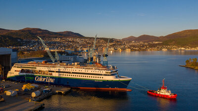The evening sun settling over the 'Color Hybrid' during her launch from the dock hall at Ulstein Verft. (Photo: Oclin / Hallstein Mala)