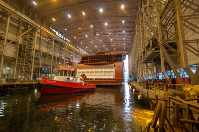 The Color Hybrid being towed into the dock hall at Ulstein Verft.