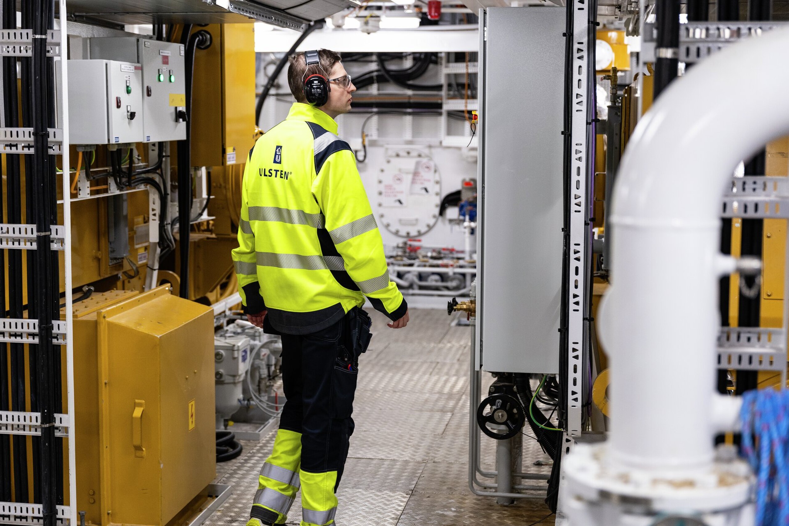 Electrician in the engine room of Olympic Notos, October 2024. 