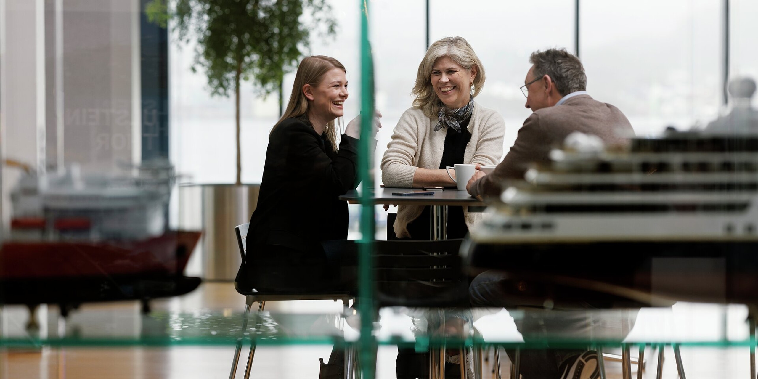 Informal meeting with coffee cups in the cafeteria